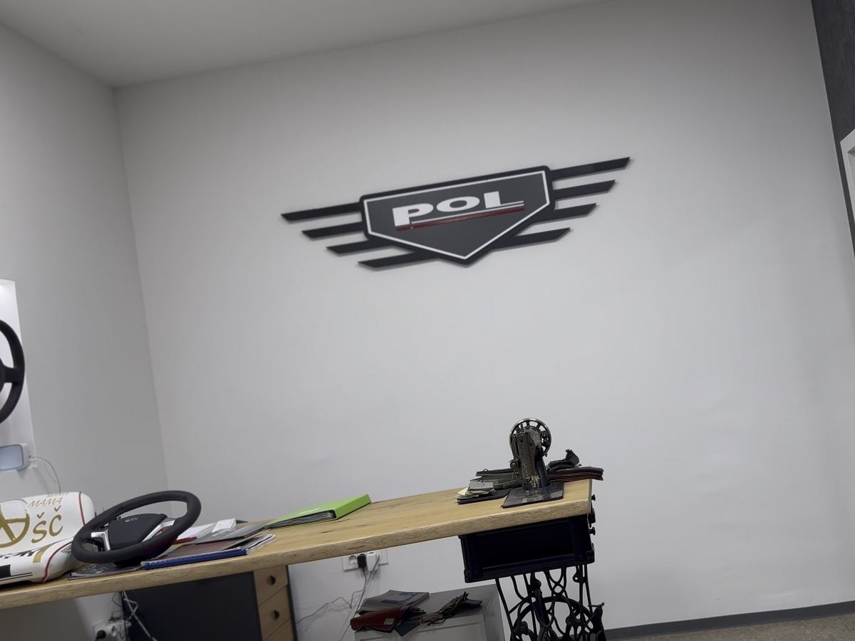 The POL showroom with the logo on the wall