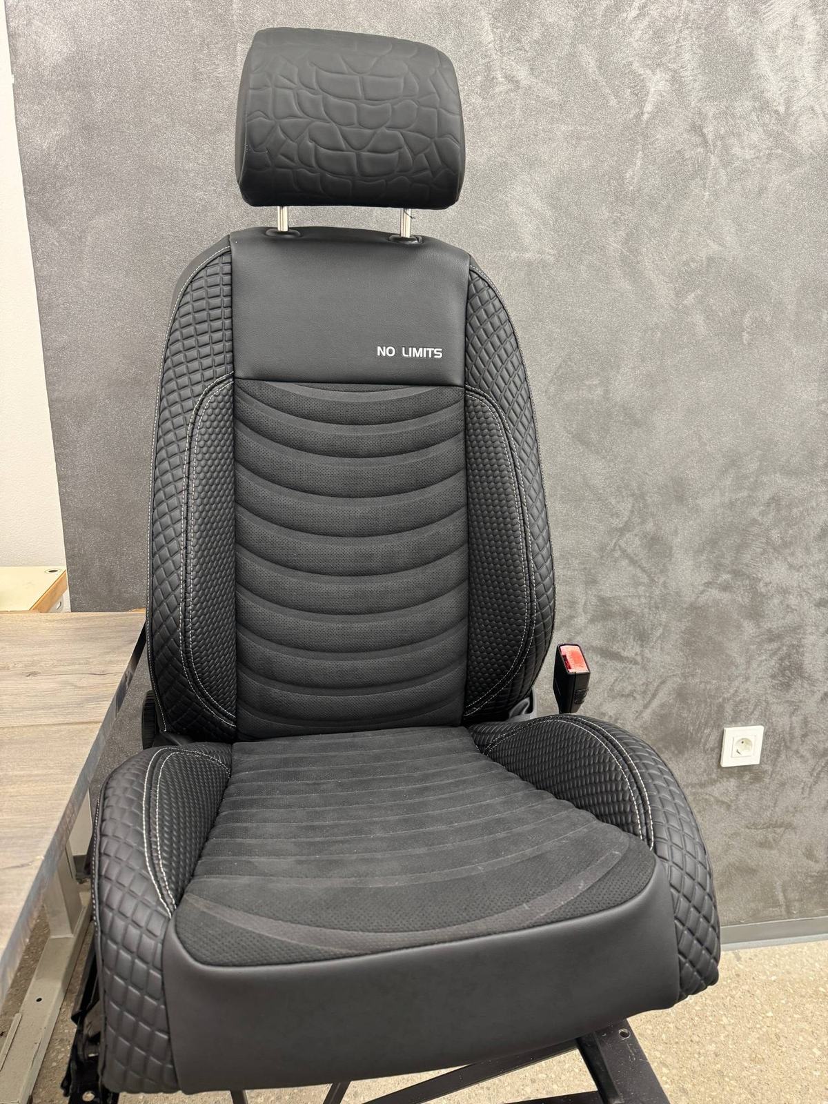The finished Kobra seat, with a No Limits inscription and quilted side bolsters
