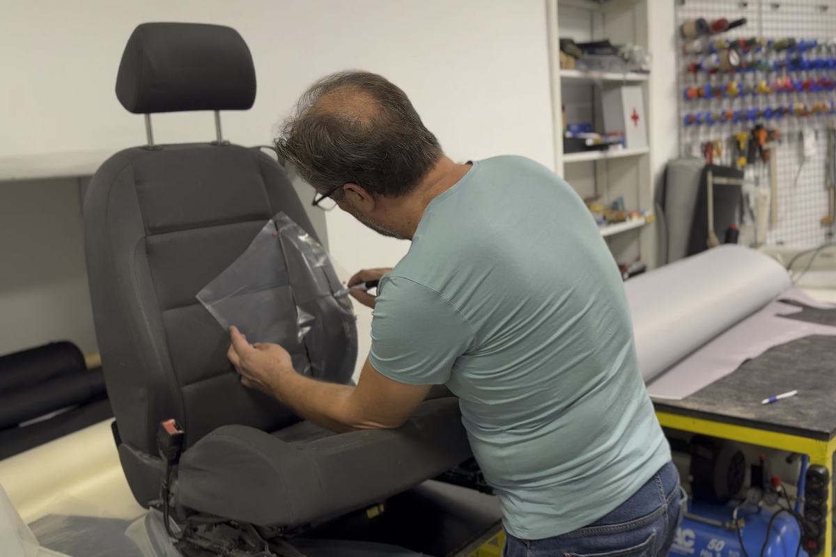 Miroslav Božić tracing the shape of a seat on clear film